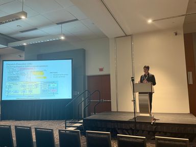 Jiayi presenting DICE at ISCA 2026